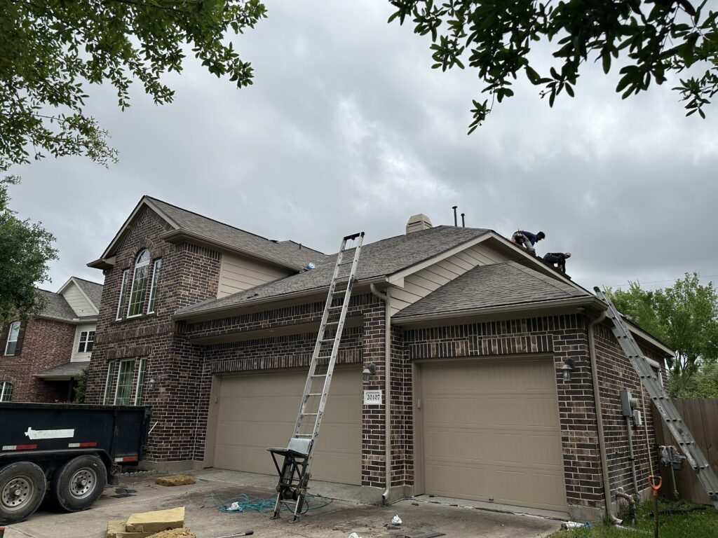 Roofing Contractors Replacing Shingles